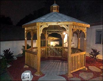 10 Cedar Octagon Gazebo shown with Clear Stain, Old English Pewter Asphalt Shingles, and Stainless Steel Hardware.