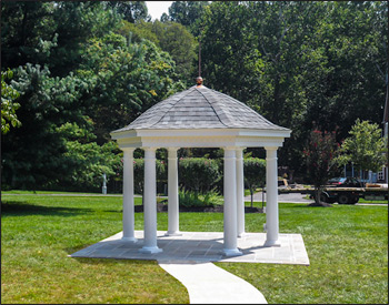  10 Vinyl Hexagon Belle Gazebo shown with 10" Round Tapered Vinyl Columns, No Deck, Dentil Molding Trim, Old English Pewter Asphalt Shingles, and 40" Copper Finial, Standard Finished Vinyl Ceiling.