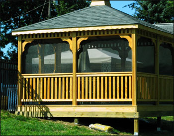 12 x 12 Treated Pine Rectangular Gazebo shown with full set of screens and screen door, cedar tone stain/sealer, and customer supplied shingles.  