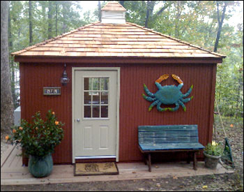 12x14 Cedar Rectangular Cabana shown with 7 insulated windows, cedar shingles, custom 4” grooved siding, with solid color stain, cupola, and finished interior and ceiling 