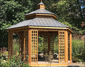 14 Custom Cedar Hexagon Double Roof Gazebo shown with Sandcastle Composite Deck, Custom Lattice Panels, Cupola, and Charcoal Metal Roof.