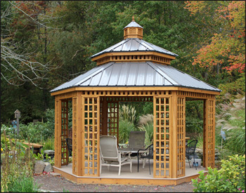 14 Custom Cedar Hexagon Double Roof Gazebo shown with Sandcastle Composite Deck, Custom Lattice Panels, Cupola, and Charcoal Metal Roof.