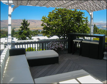 14 x 16 Vinyl 2-Beam Pergola shown with 8" Top Runner Spacing, Stainless Steel Hardware, 36" Post Trim, and Gray Black and White Retractable Canopy.