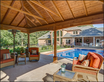  16 x 20 Cedar Ramada shown with No Deck, 16" Post Trim, Dual Gray Asphalt Shingles, Cedar Stain, 6x6 Posts, and Arched Beams.