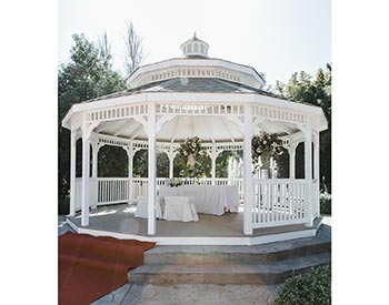 20 Vinyl Double Roof Dodecagon Gazebo shown with Harbor Grey Composite Deck, Old English Pewter Asphalt Shingles, Two Additional Entrances, Four Benches, and Customer Painted Ceiling.