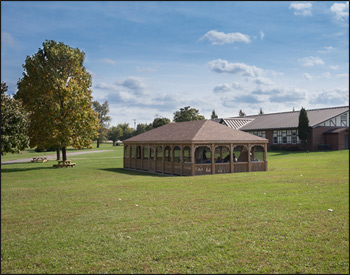 20 x 40 Treated Pine Rectangular Gazebo shown with 1x3 standard railings, standard braces, no cupola, full set of screens and screened door, Rustic Cedar Owens Harding Duration Shingles (upgrade), 36" post trim and no deck.