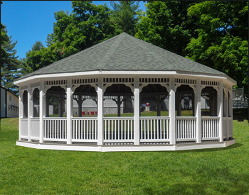 30 Vinyl Dodecagon Gazebo shown with Gray composite deck, 1x1 railings, standard braces, no cupola, full set of screens and screen door, Old English Pewter asphalt shingles, Appliance White Avruc Outdoor Ceiling Fan w/ Light, screened floor, Hidden Wiring w/ 1 Receptacle & Switch, extra receptacle, additional door, straight posts, and top railing sections.