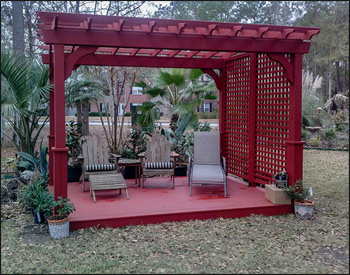 8 x 12 Treated Pine Arched Pergola shown with Treated Pine Deck, Sequoia Stain, 36" Post Trim, and Full Wall Lattice Privacy Wall. 