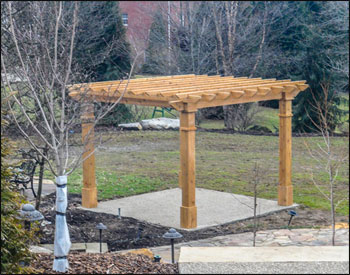 10 x 10 Red Cedar Solace Free Standing Pergola shown with Custom Semi-Transparent Stain/Sealer , 16" Top Runner Spacing, and Custom Trim