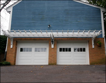 Custom Treated Pine 26 x 3 Wall Mounted Pergola shown with white paint.