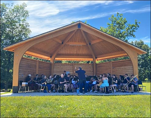 35 Sydney Half Hexagon Amphitheater shown with Natural Stain, 3 Back Wall sections, and Asphalt Shingles